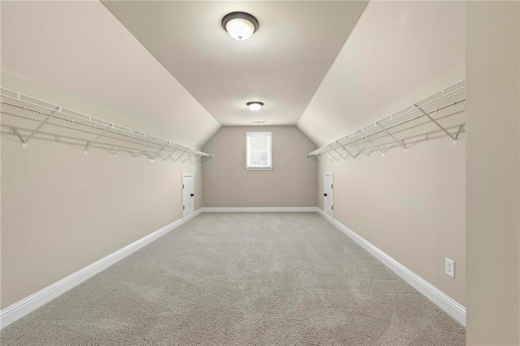 2602 Alcovy Club Drive Dacula, GA 30019 - Photo 22 of 44 an empty room with a empty space and windows
