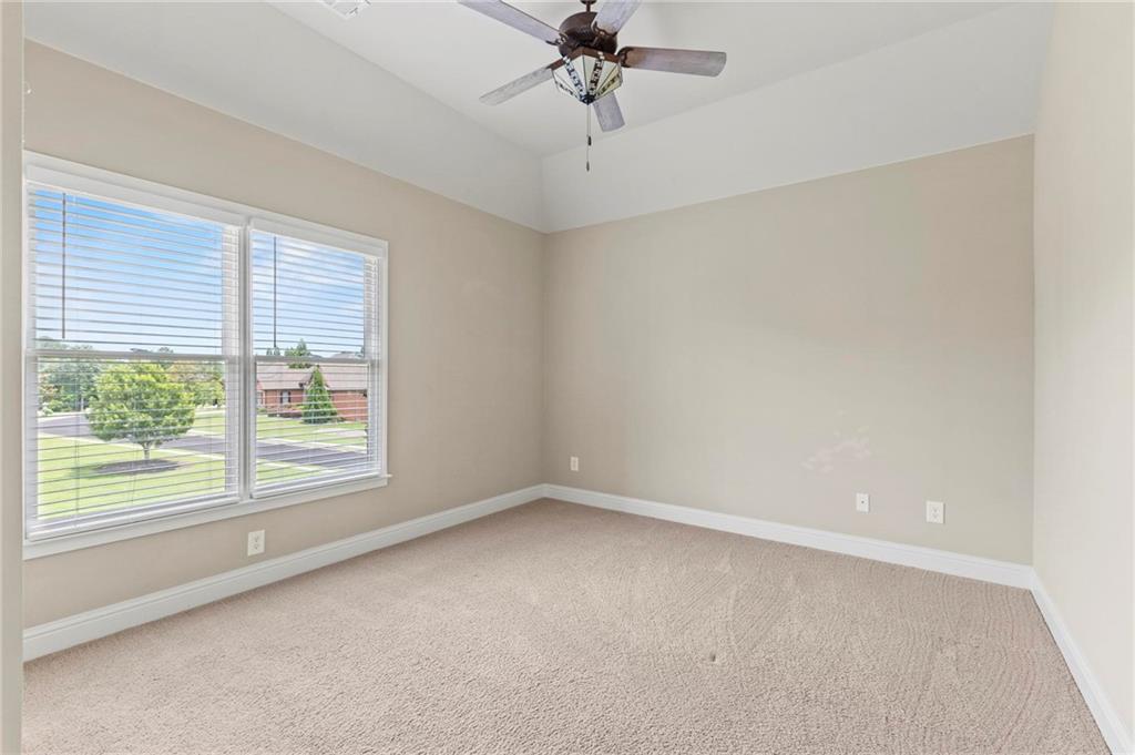 2602 Alcovy Club Drive Dacula, GA 30019 - Photo 30 of 44 an empty room with a window and a ceiling fan