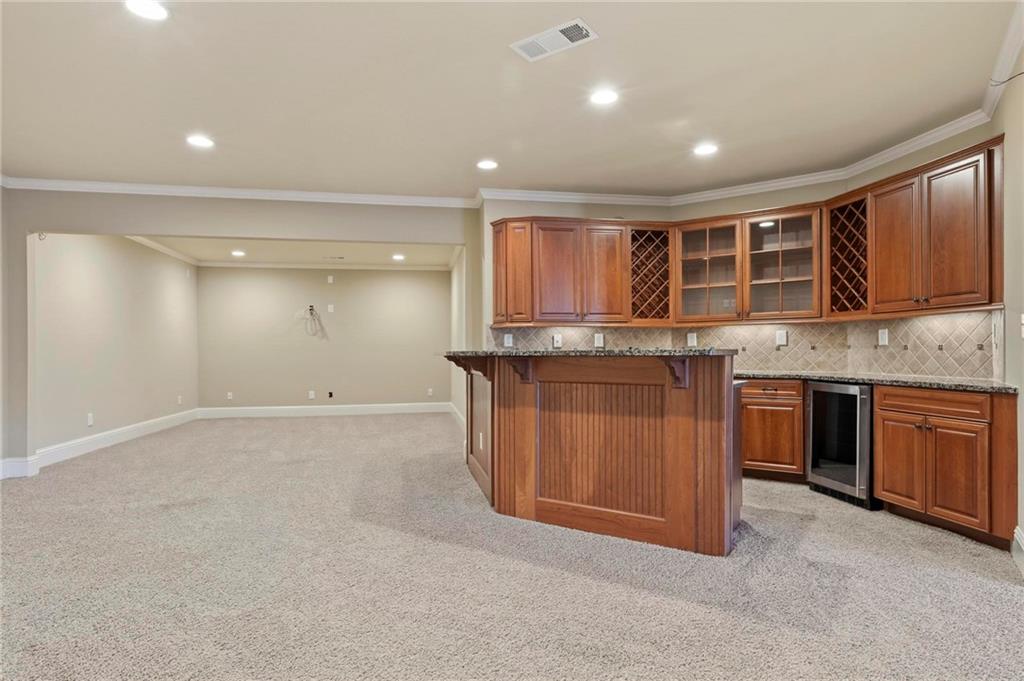 2602 Alcovy Club Drive Dacula, GA 30019 - Photo 31 of 44 a view of a kitchen with a sink and cabinets