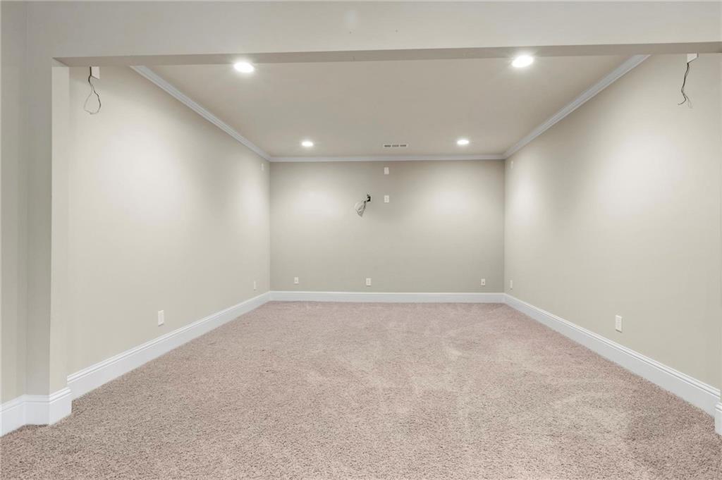 2602 Alcovy Club Drive Dacula, GA 30019 - Photo 32 of 44 an empty room with a empty space and windows