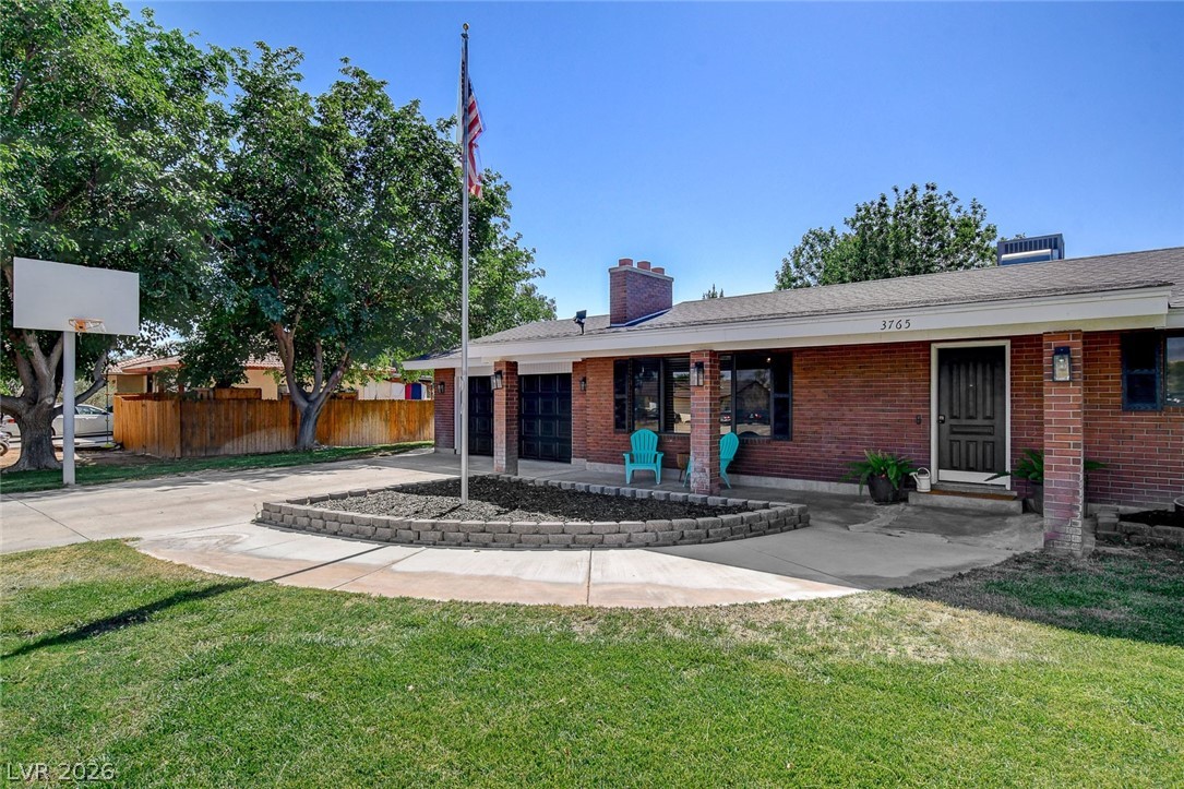 3765 Berkeley Street Logandale, NV 89021 - Photo 7 of 87 This classic brick residence features an inviting front facade and a well-maintained lawn.