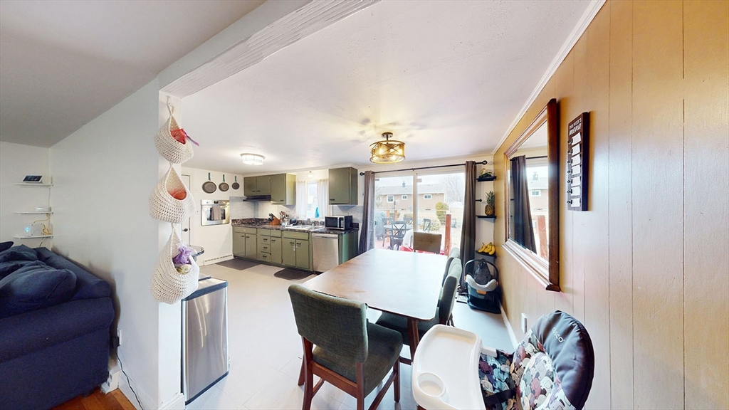 706 Mohawk Road Somerset, MA 02726 - Photo 11 of 33 a view of a dining room with furniture and a chandelier