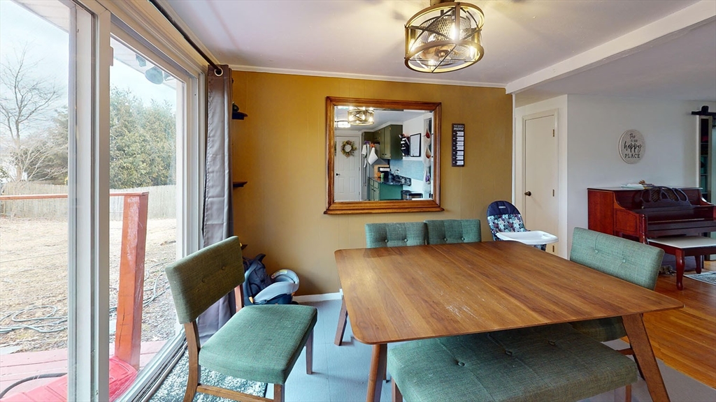 706 Mohawk Road Somerset, MA 02726 - Photo 12 of 33 a view of a dining room with furniture and a window