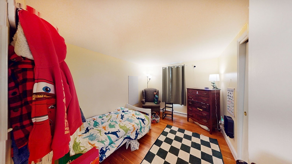 706 Mohawk Road Somerset, MA 02726 - Photo 13 of 33 a bed room with a bed and a chair