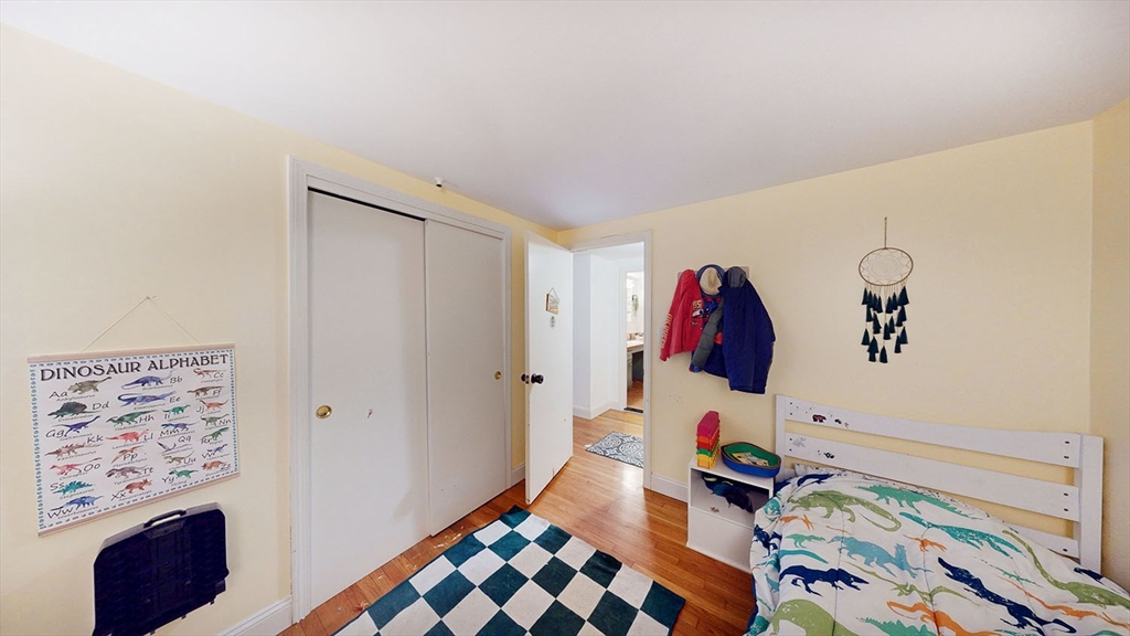 706 Mohawk Road Somerset, MA 02726 - Photo 14 of 33 a bedroom with a bed and a painting on the wall