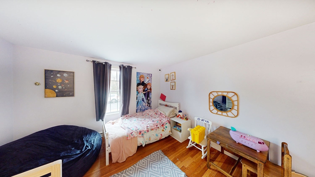 706 Mohawk Road Somerset, MA 02726 - Photo 18 of 33 a bedroom with a bed and wooden floor