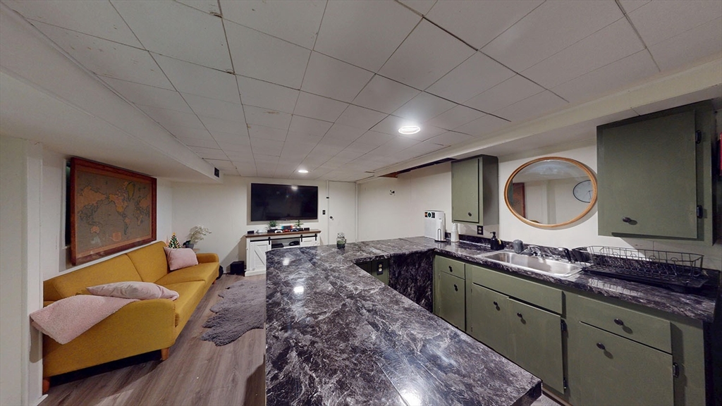 706 Mohawk Road Somerset, MA 02726 - Photo 27 of 33 a large kitchen with stainless steel appliances granite countertop a sink and a stove