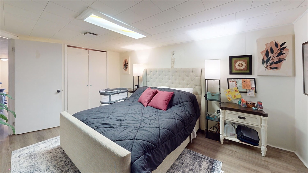 706 Mohawk Road Somerset, MA 02726 - Photo 30 of 33 a bed room with a bed and a couch