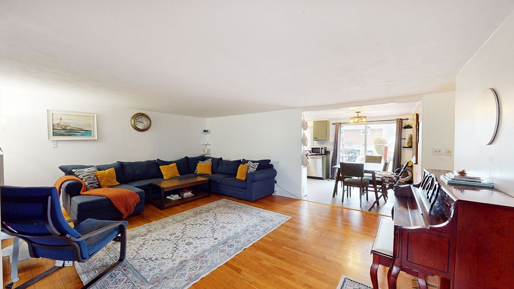 706 Mohawk Road Somerset, MA 02726 - Photo 3 of 33 a living room with furniture and wooden floor
