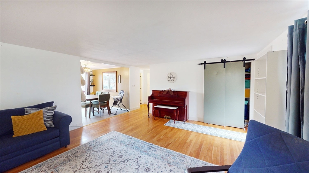 706 Mohawk Road Somerset, MA 02726 - Photo 4 of 33 a living room with furniture and a rug