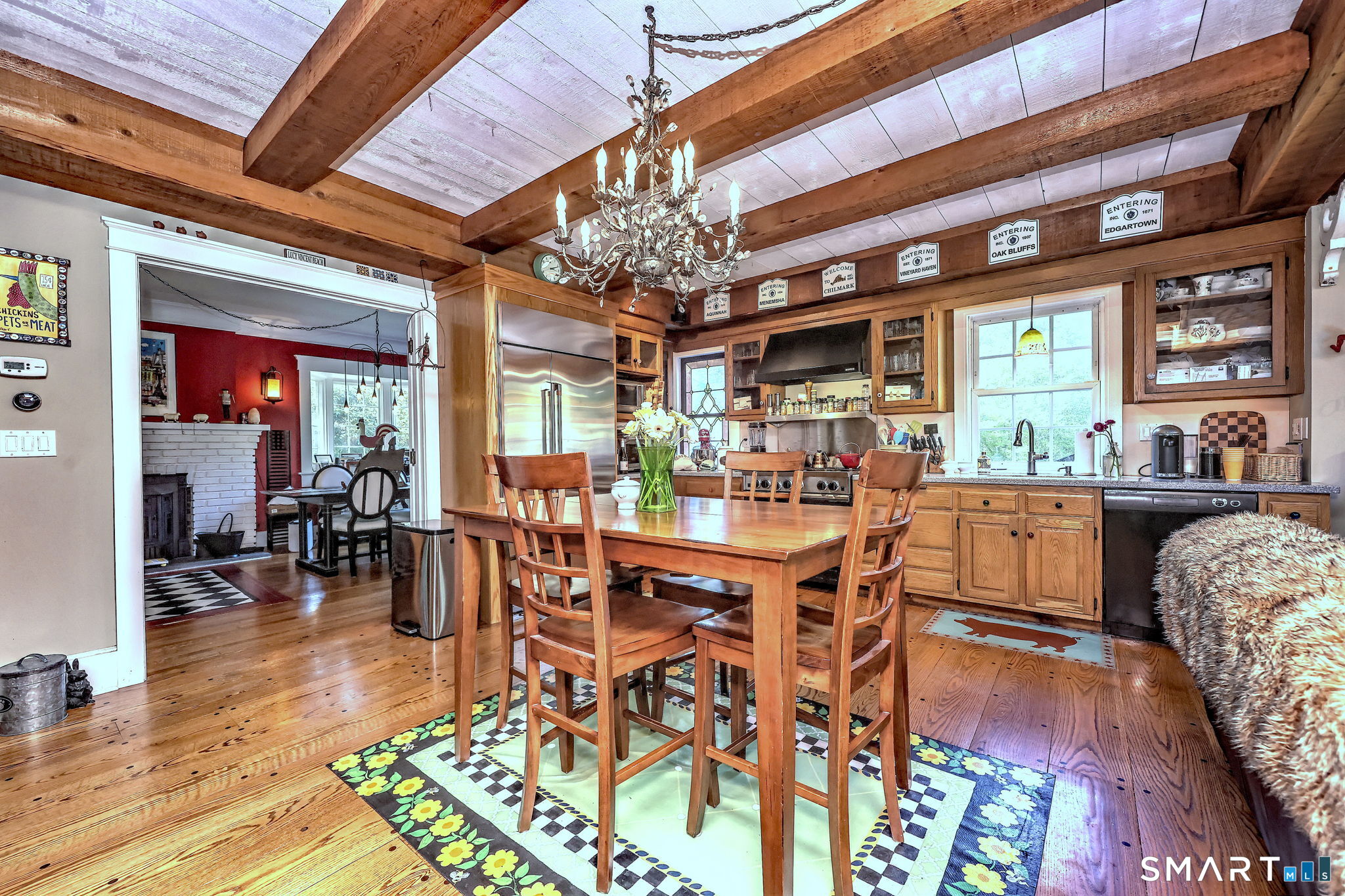 25 Center Road Woodbridge, CT 06525 - Photo 12 of 34 a view of a dining room with furniture a chandelier and wooden floor