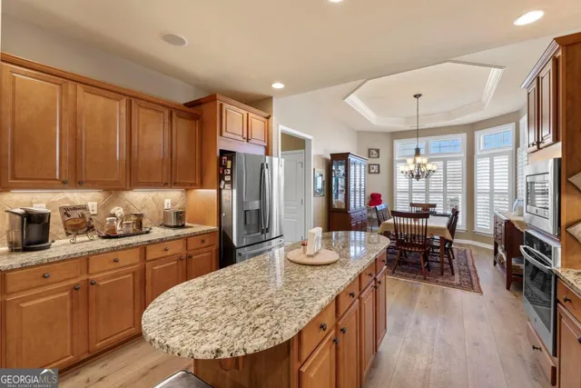 a view of a dining room with furniture and window