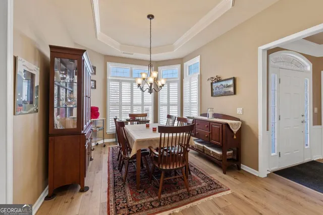 a bathroom with a granite countertop tub sink and mirror