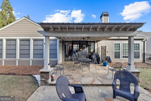 a view of a house with patio outdoor seating