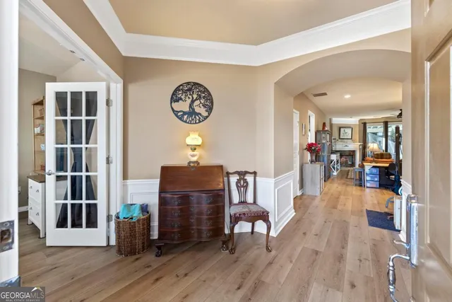 a large bathroom with a granite countertop sink a toilet a mirror and shower