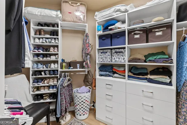a view of patio with a table and chairs and potted plants