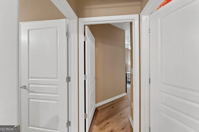 a view of a patio with table and chairs and floor to ceiling window