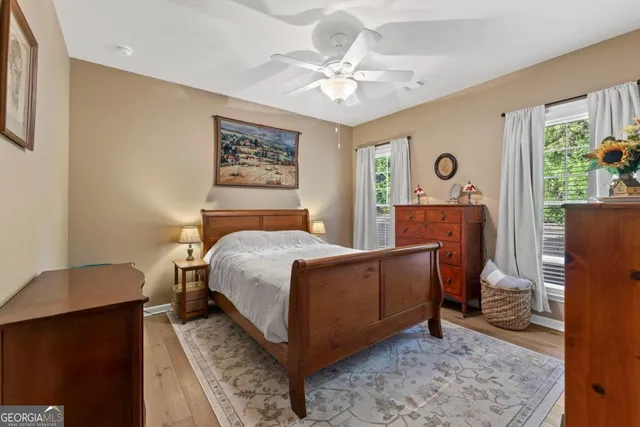 a living room with furniture a fireplace and a window