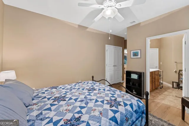 a view of a brick house with a large windows and a large tree