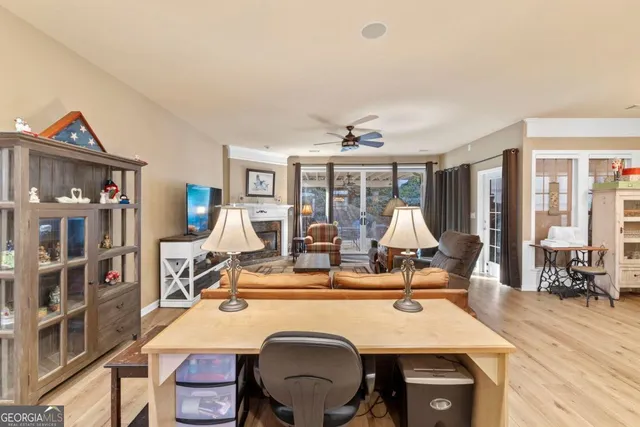 a living room with furniture flat screen tv and a fireplace