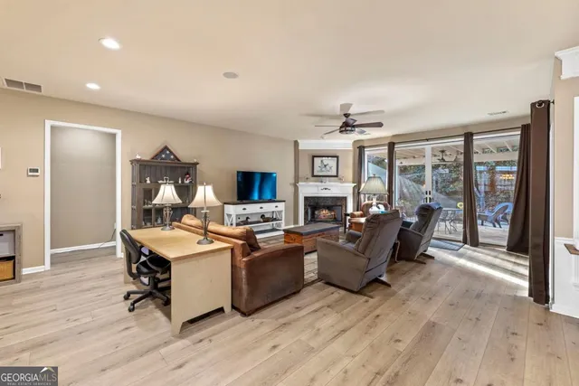 a view of a livingroom with furniture furniture and wooden floor