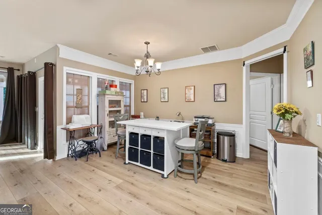 a view of a dining room with furniture and a livingroom
