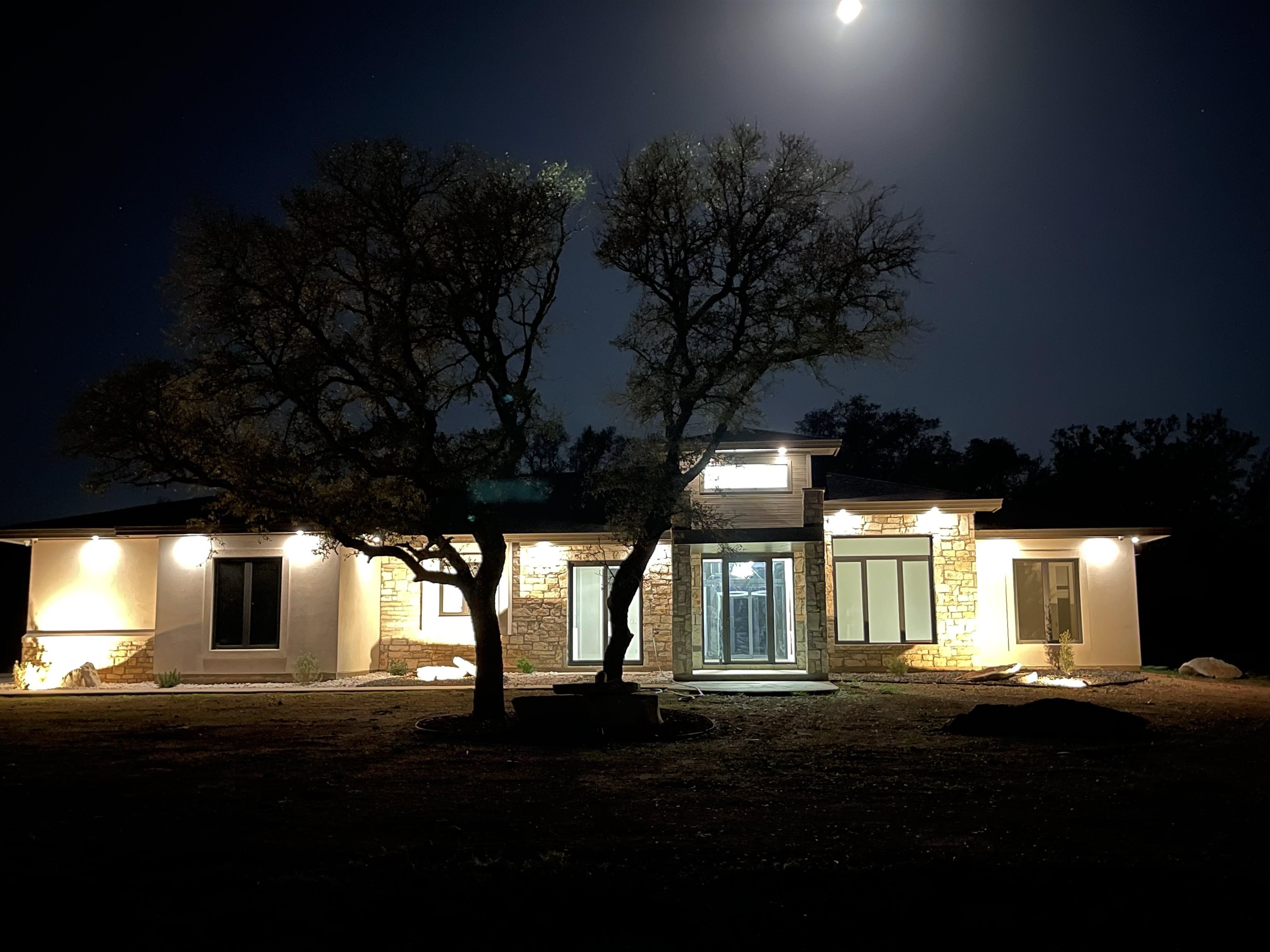 a view of house with yard and green space