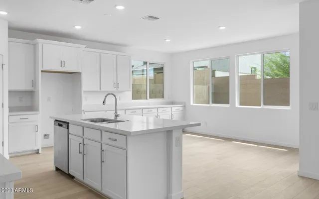 a kitchen with sink and window
