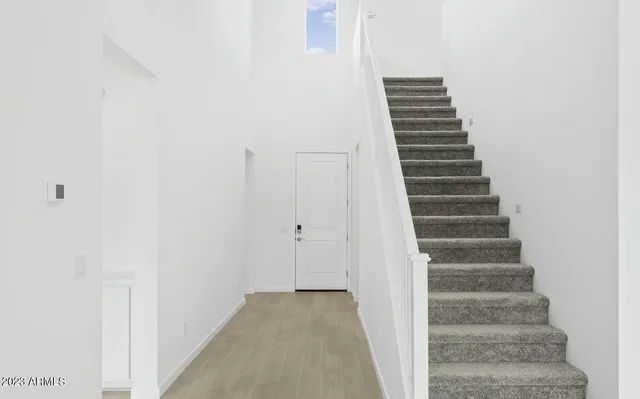a view of a hallway with stairs