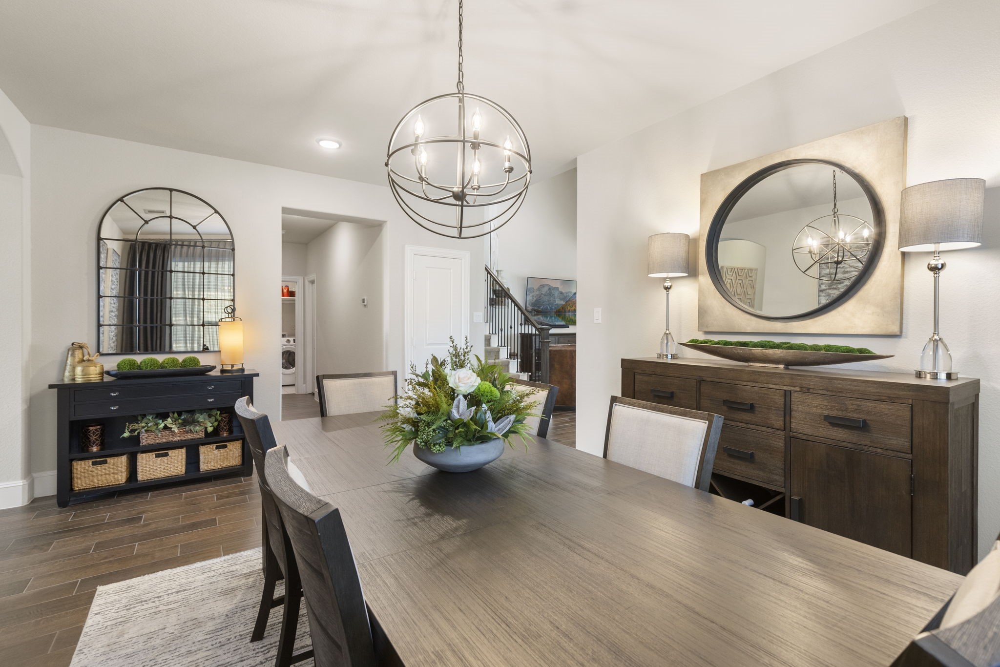 1030 Bat Hawk Court Conroe, TX 77385 - Photo 13 of 47 a living room with furniture a chandelier and wooden floor