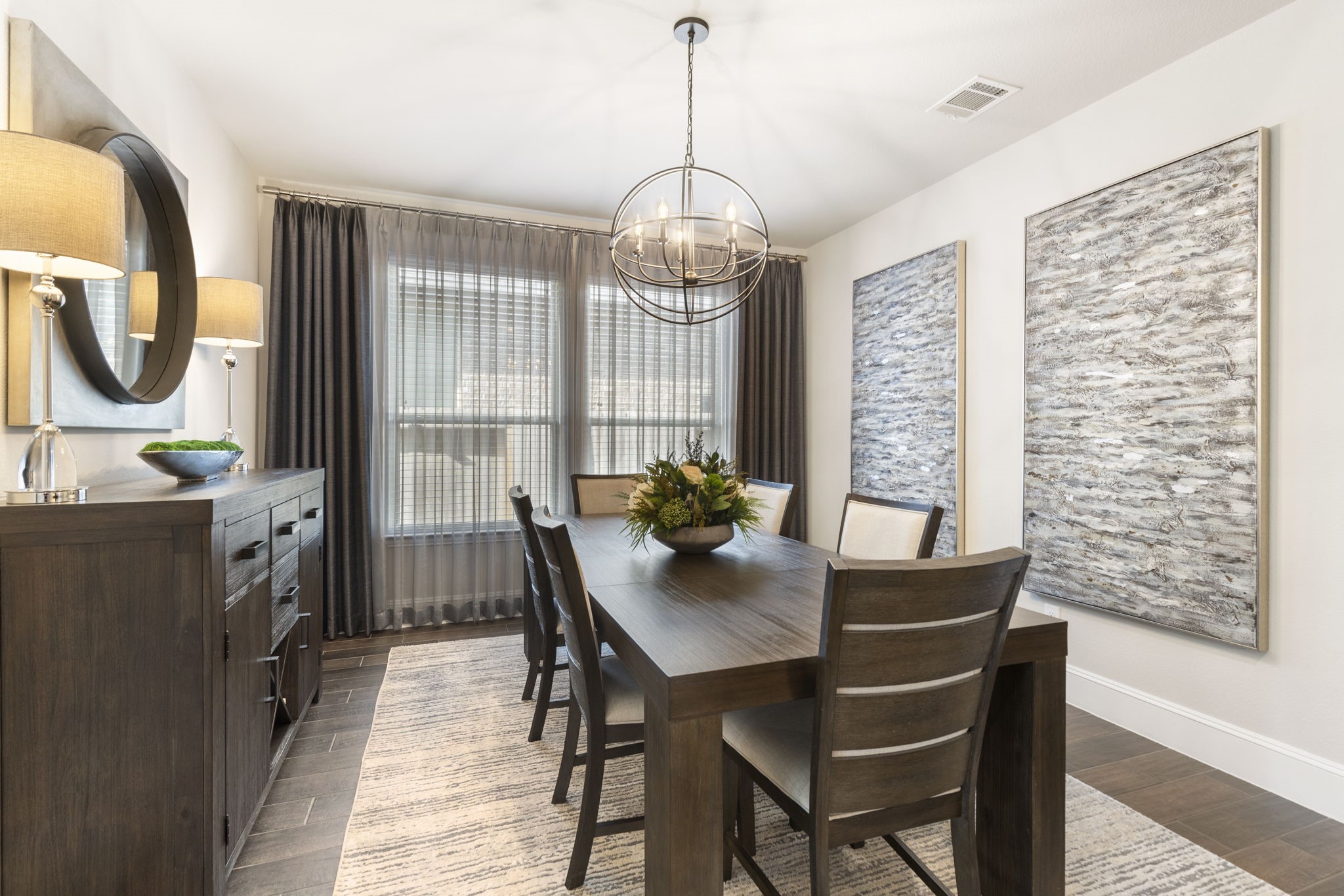 1030 Bat Hawk Court Conroe, TX 77385 - Photo 14 of 47 a dining room with furniture a chandelier and wooden floor