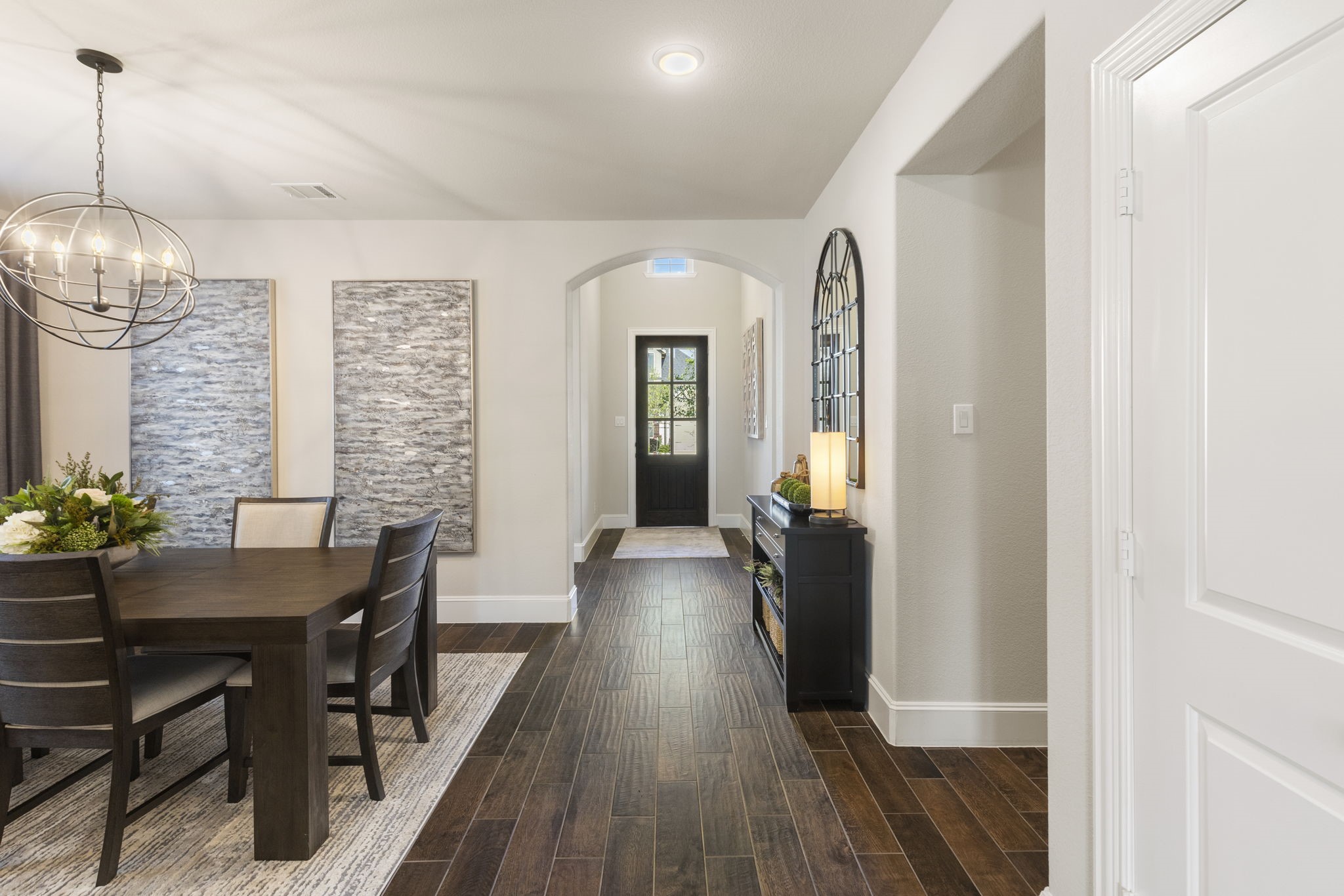 1030 Bat Hawk Court Conroe, TX 77385 - Photo 15 of 47 a view of a dining room with furniture window and wooden floor