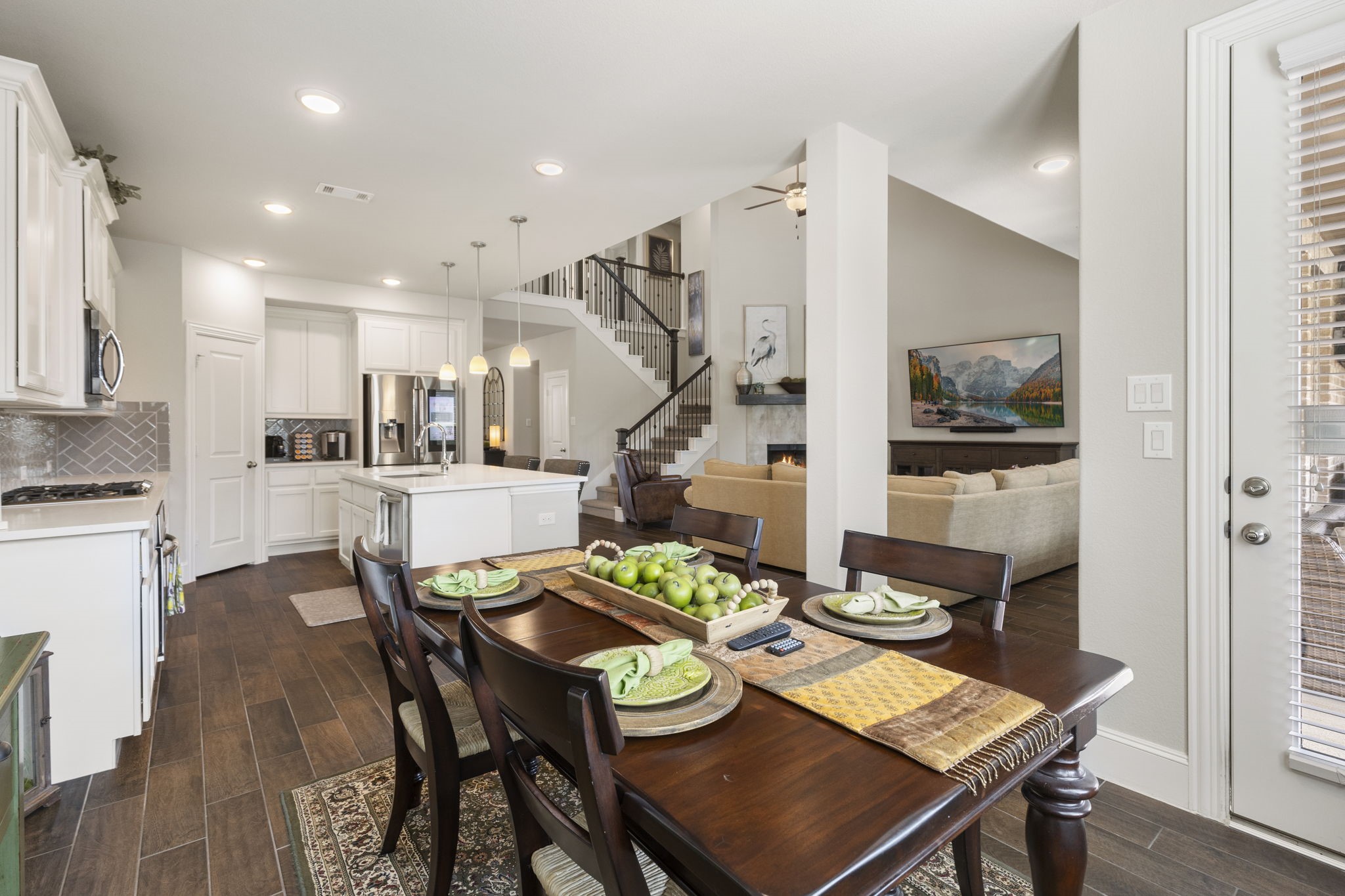 1030 Bat Hawk Court Conroe, TX 77385 - Photo 20 of 47 a view of a dining room with furniture and wooden floor