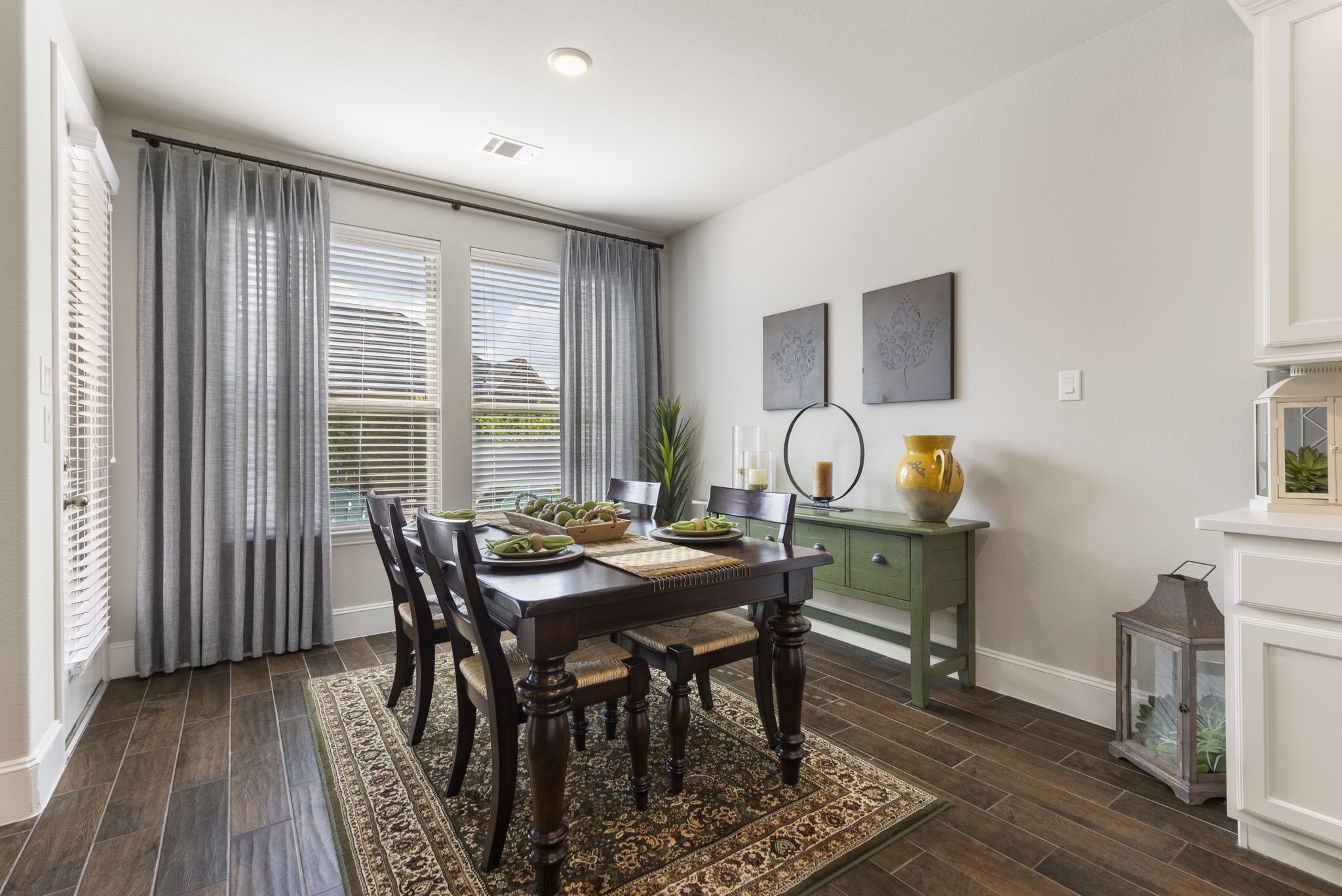 1030 Bat Hawk Court Conroe, TX 77385 - Photo 21 of 47 a view of a dining room with furniture and wooden floor