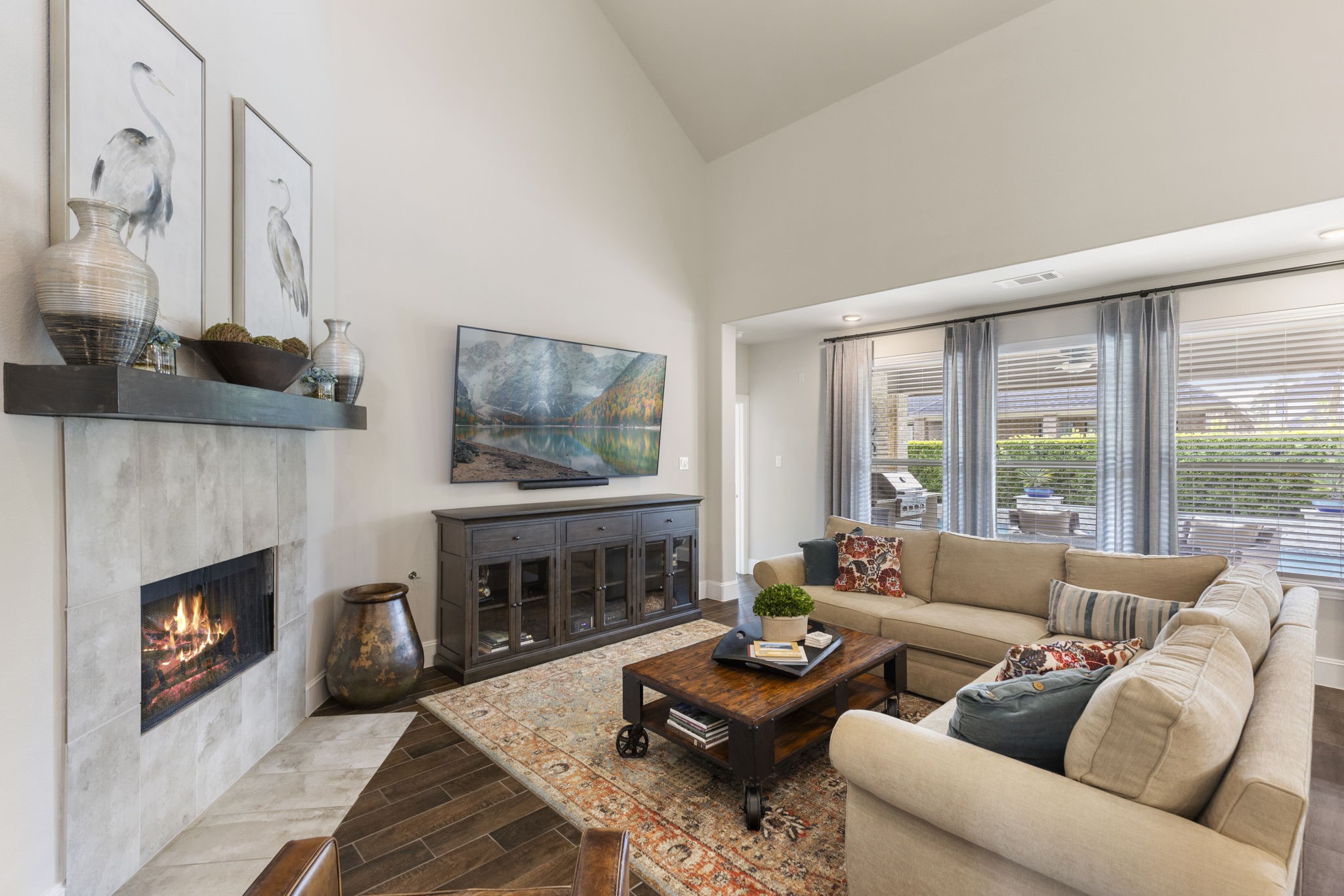 1030 Bat Hawk Court Conroe, TX 77385 - Photo 23 of 47 a living room with furniture a fireplace and a large window