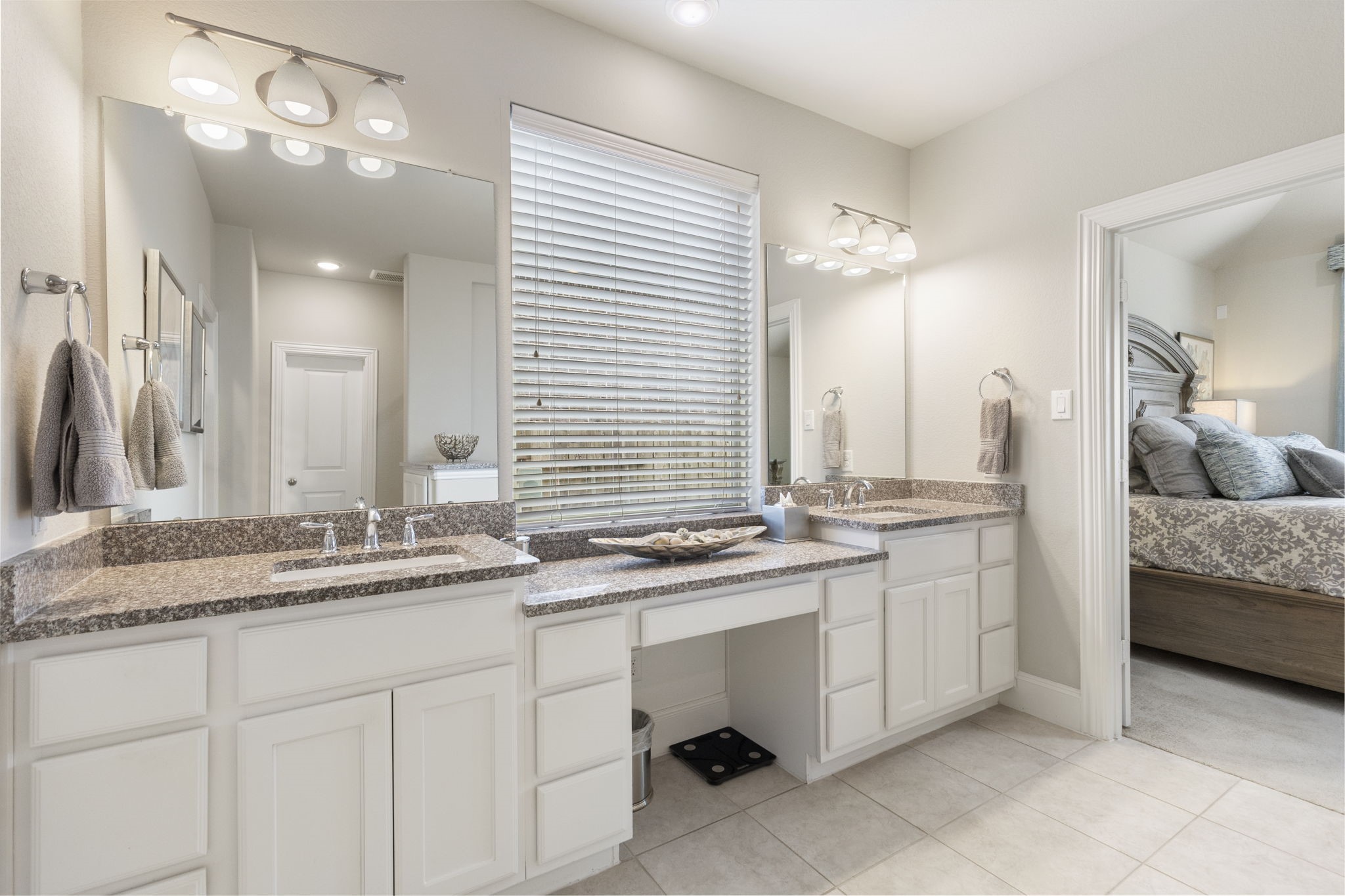1030 Bat Hawk Court Conroe, TX 77385 - Photo 28 of 47 a bathroom with a sink double vanity and a mirror