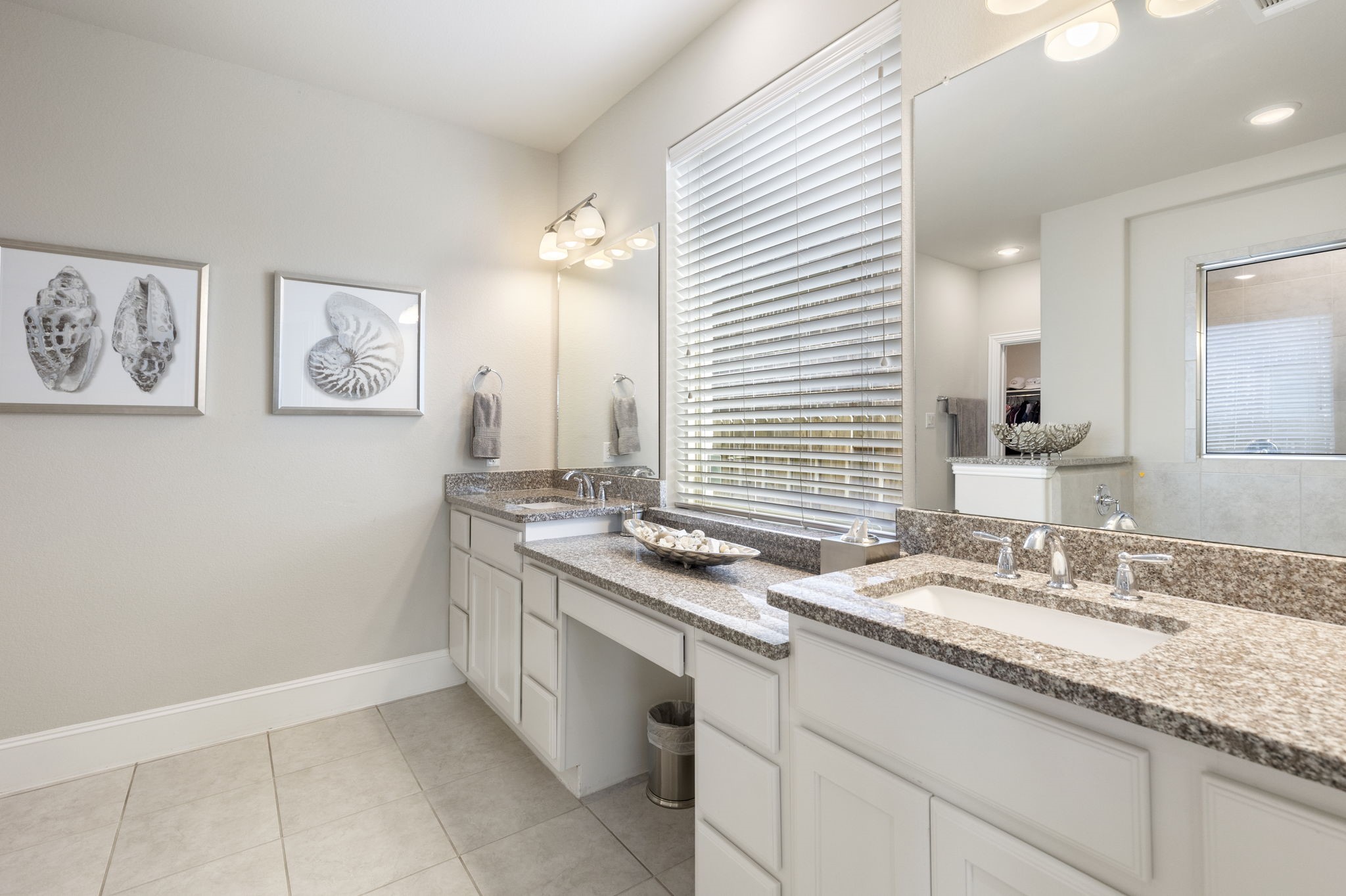 1030 Bat Hawk Court Conroe, TX 77385 - Photo 29 of 47 a bathroom with a granite countertop sink and a mirror