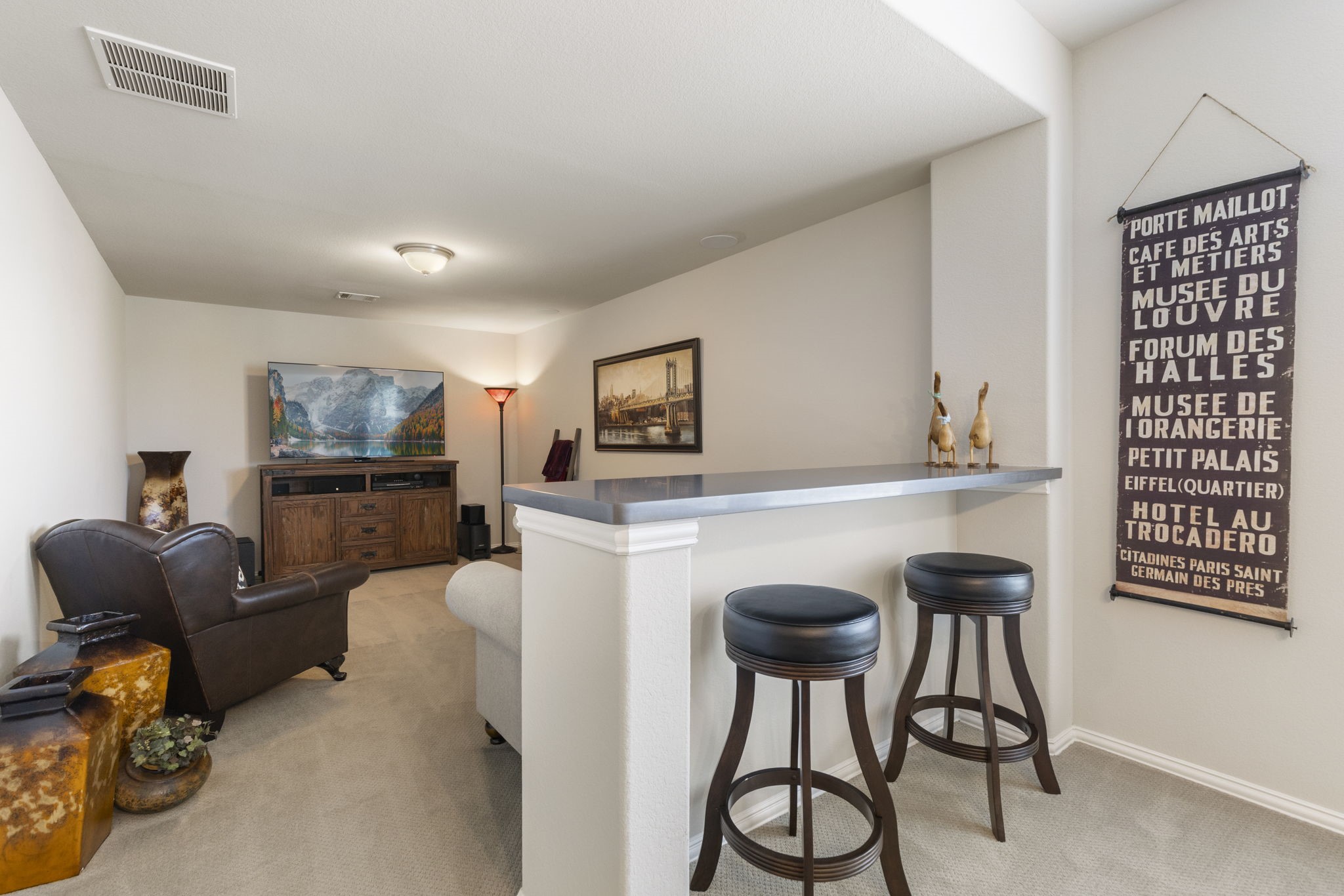 1030 Bat Hawk Court Conroe, TX 77385 - Photo 35 of 47 a living room with furniture and a flat screen tv
