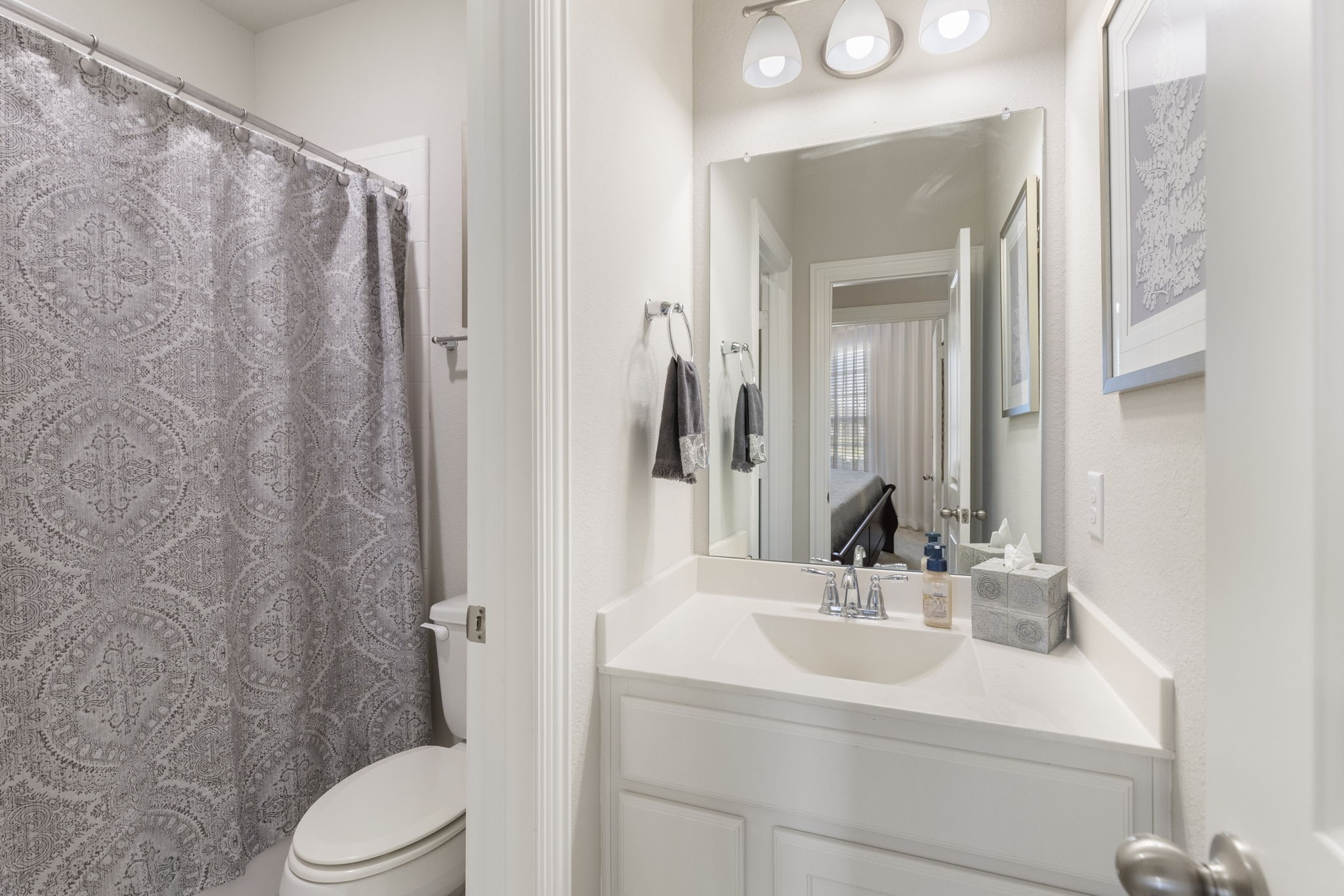 1030 Bat Hawk Court Conroe, TX 77385 - Photo 37 of 47 a bathroom with a sink a toilet and shower