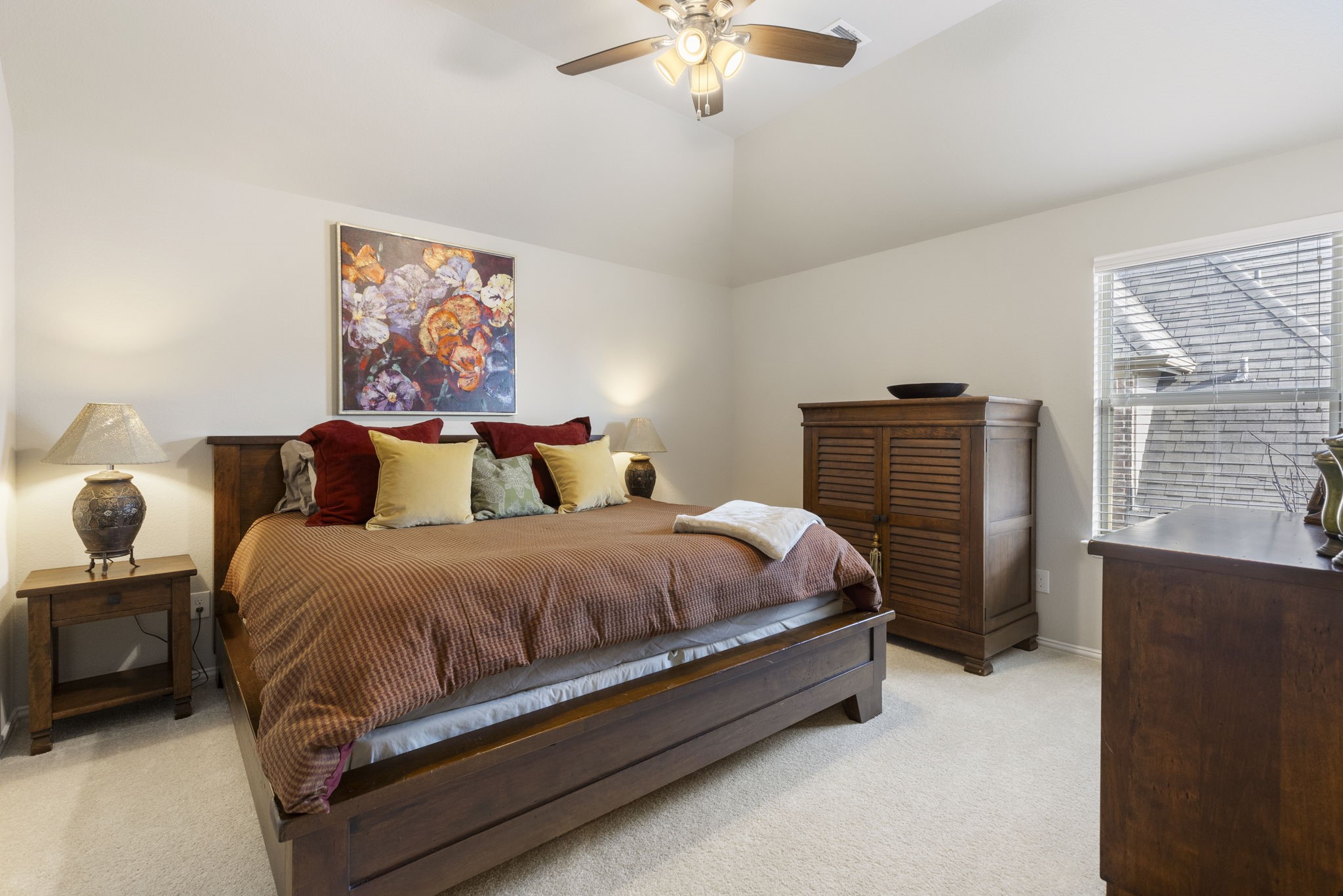 1030 Bat Hawk Court Conroe, TX 77385 - Photo 41 of 47 a spacious bedroom with a bed and a chandelier