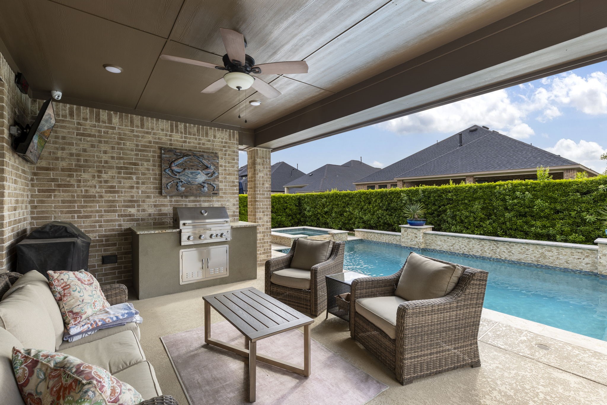 1030 Bat Hawk Court Conroe, TX 77385 - Photo 7 of 47 a outdoor living space with furniture and a fireplace