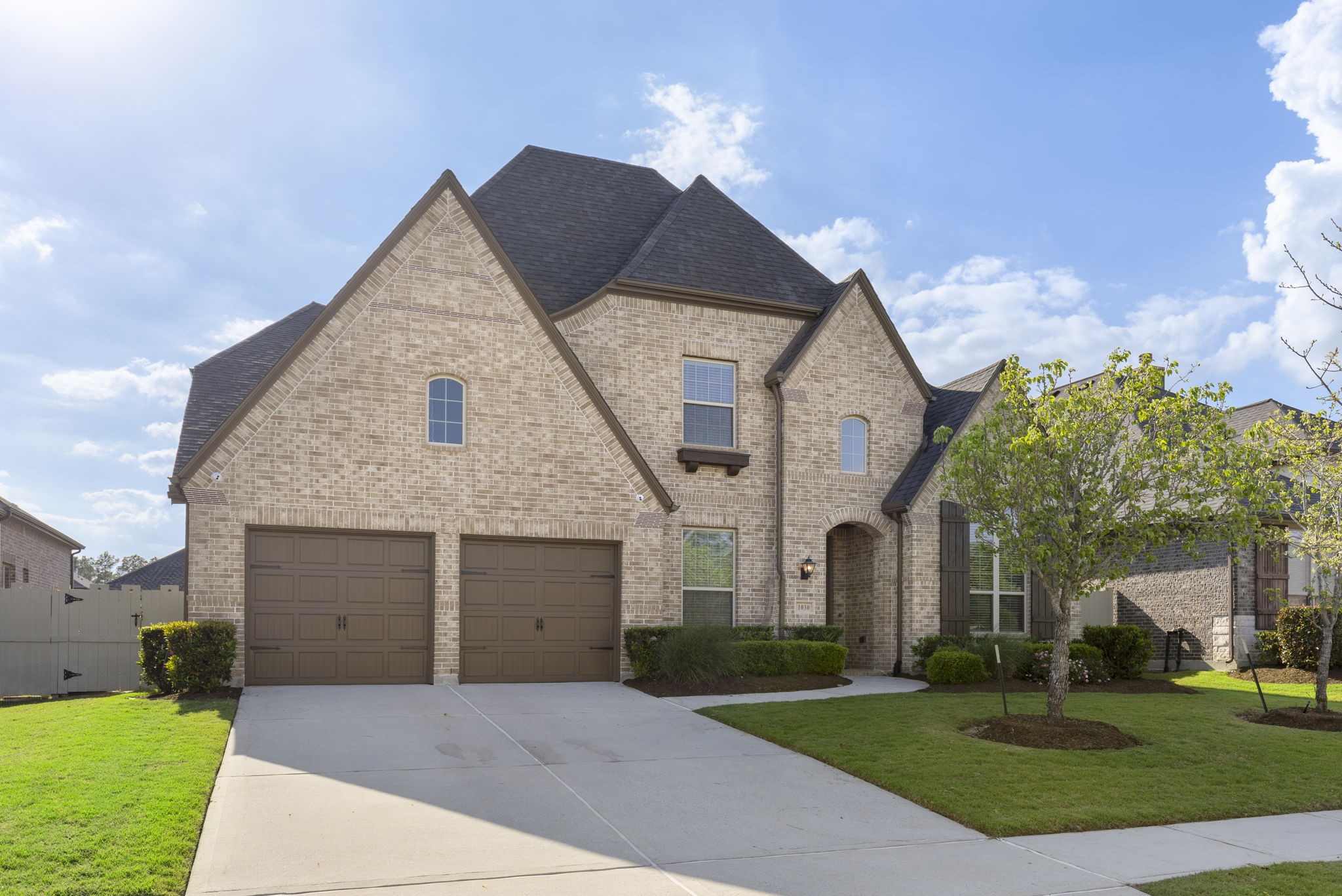 1030 Bat Hawk Court Conroe, TX 77385 - Photo 8 of 47 a front view of a house with a yard