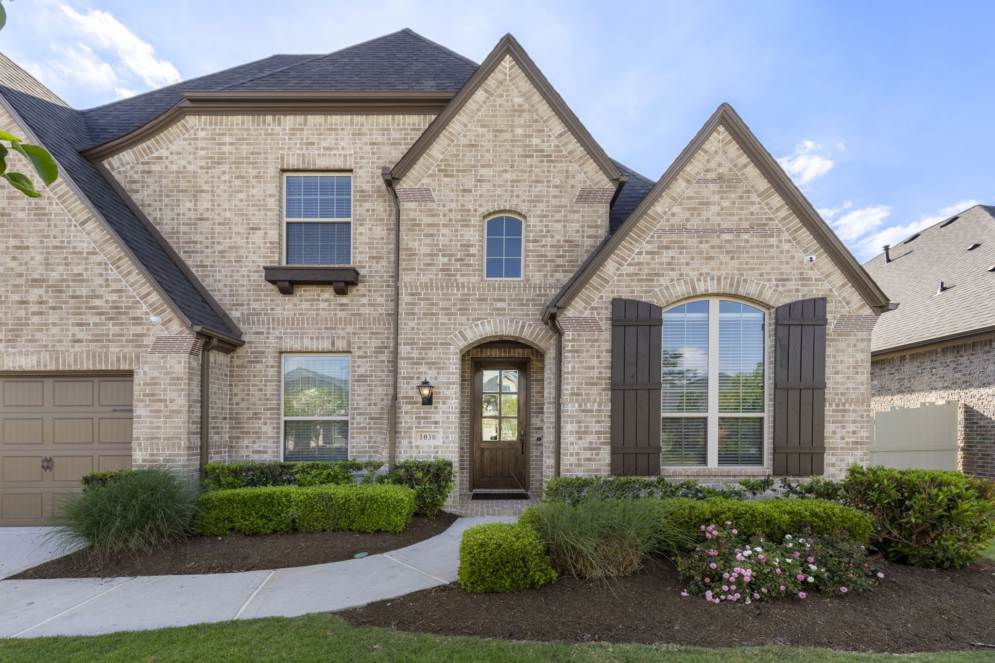 1030 Bat Hawk Court Conroe, TX 77385 - Photo 9 of 47 a front view of a house with garden