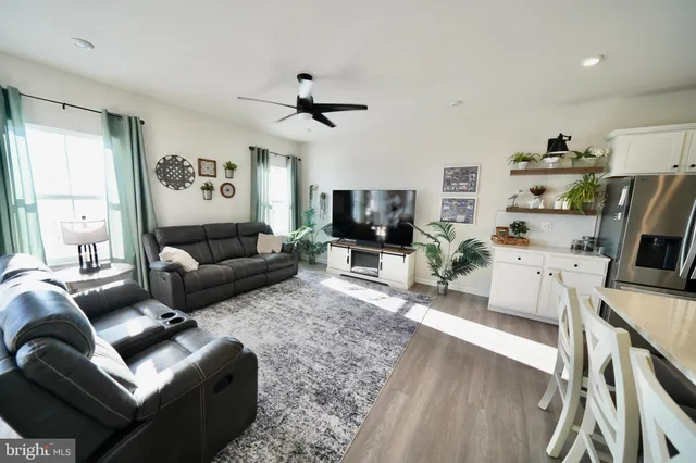 a kitchen with stainless steel appliances a sink and refrigerator