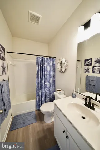 a bathroom with a double vanity sink and mirror