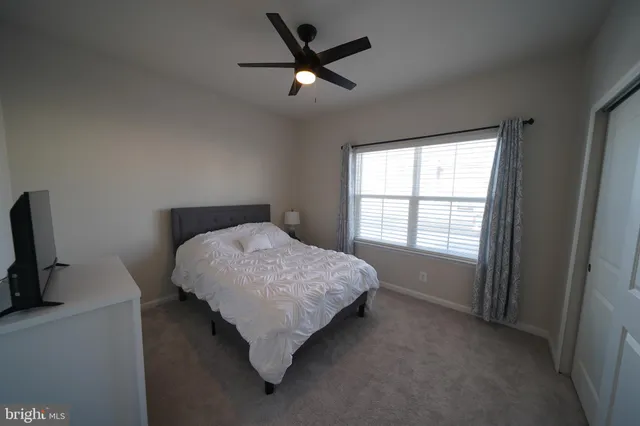 a bathroom with a double vanity sink and mirror