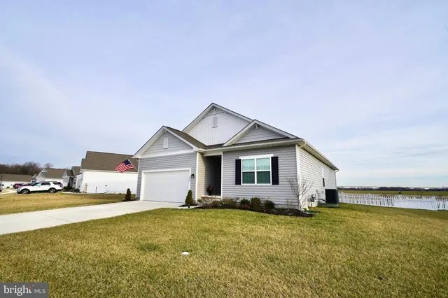 a kitchen with stainless steel appliances a sink a stove top oven a counter space and cabinets