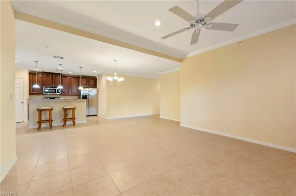 a view of a kitchen with a microwave and a sink