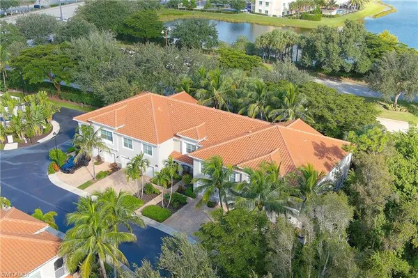 an aerial view of a house with pool outdoor seating and yard
