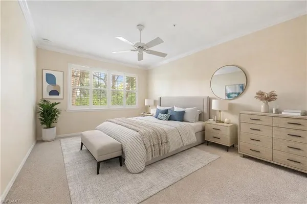 a spacious bedroom with two beds and a large window